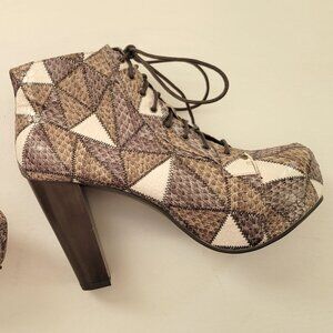 Fashionable high heeled booties in patchwork leather